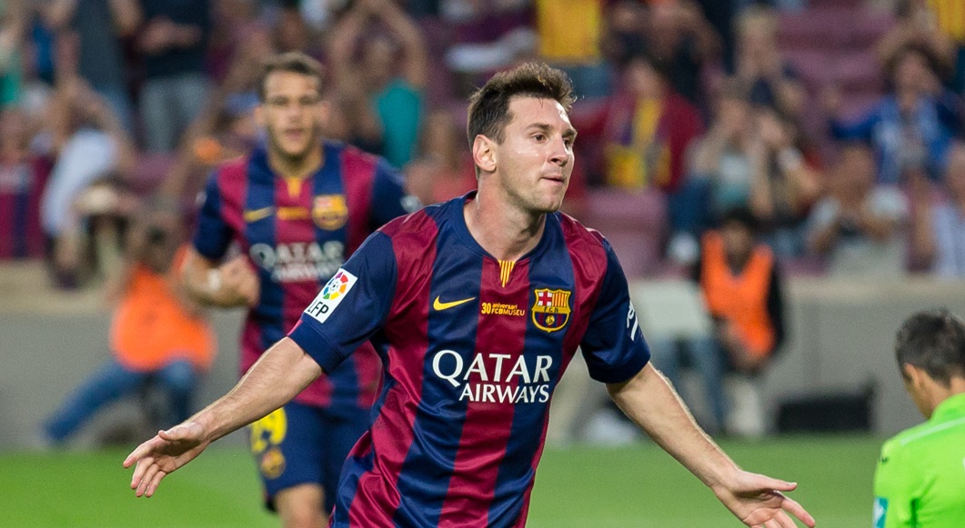 Lionel Messi celebrates scoring a goal for Barcelona