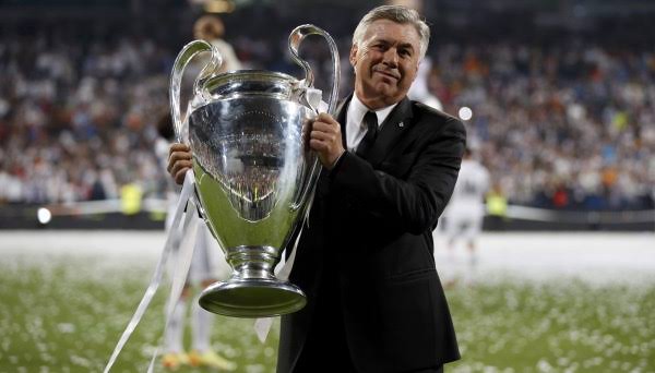 Carlo Ancelotti with the UEFA Champions League tile